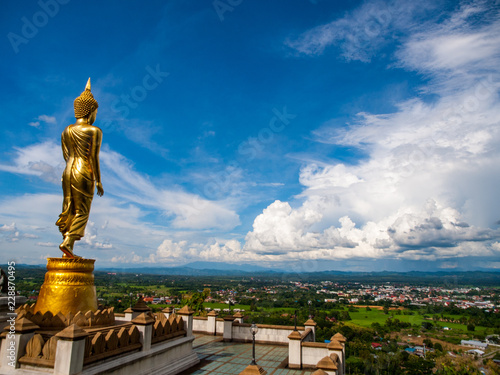 big budha over the mpuntain with blue sky photo