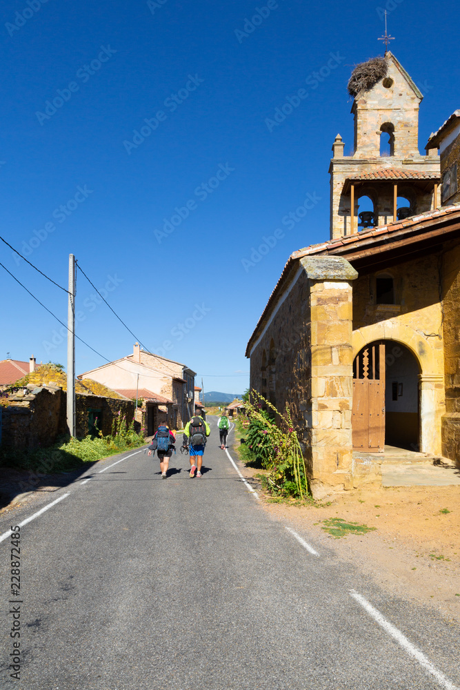 Camino de Santiago (Spain) - Pilgrims in El Ganso along the way of St.James, in the spanish meseta