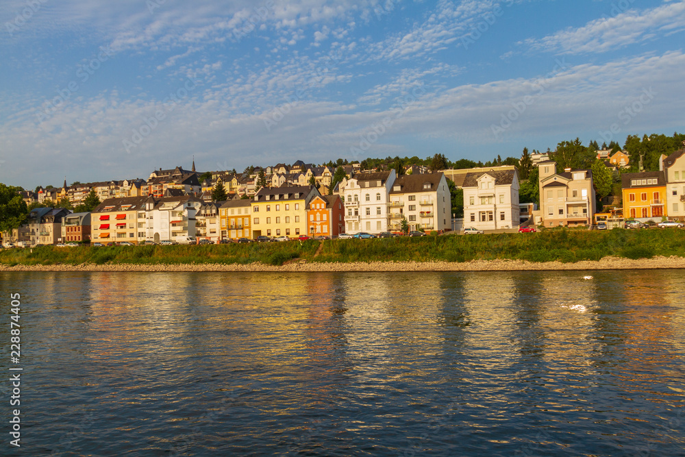 Koblenz residential section on the bank of river Rhine bathed in afternoon light.
