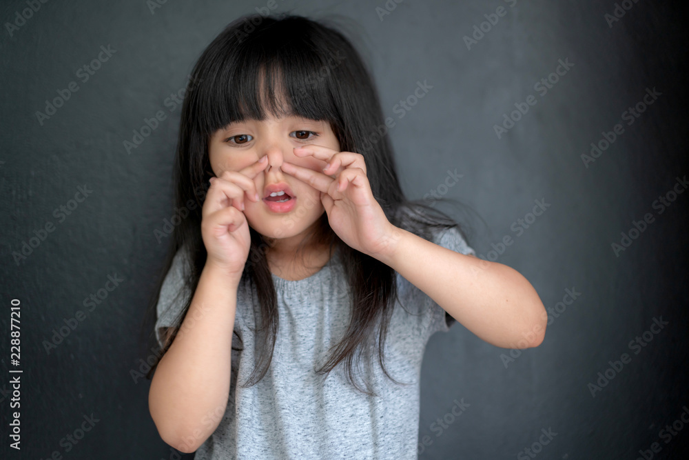 happiness black hair asian big eye girl portrait photo shoot with casual dress with fun on black screen background happiness black hair asian big eye girl portrait photo shoot with casual dress with fun on black screen background