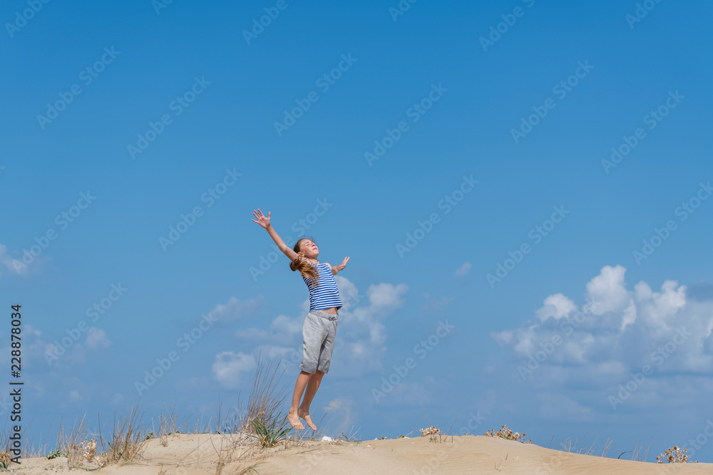 girl jumping on the beach girl jumping on the beach