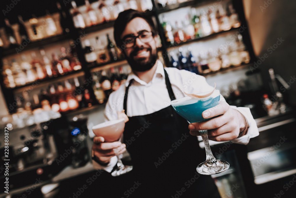 Prepared Cocktail. Bar. Barman with Beard. Rest.
