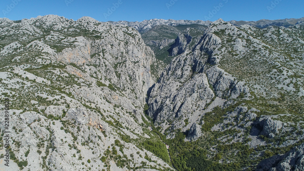 The Velika Paklenica karst river canyon is within national park, Velebit, Croatia. It is famous for hiking and free climbing on huge rock faces. 