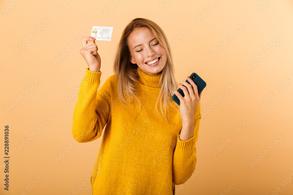 Portrait of a delighted young woman dressed in sweater Portrait of a delighted young woman dressed in sweater