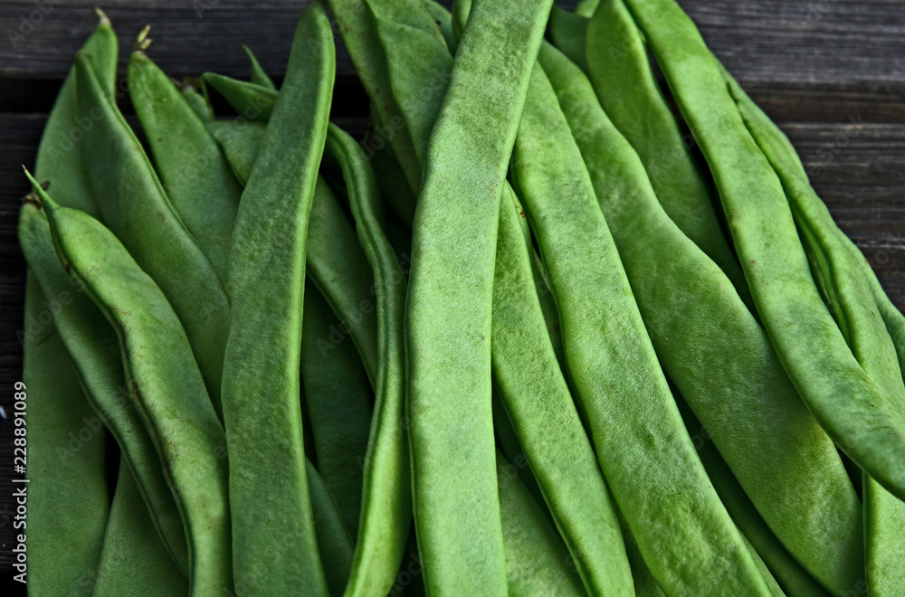 Fresh Roma II Italian Bush Bean or Romano Pole Bean (Phaseolus vulgaris) on wooden background. Fresh Roma II Italian Bush Bean or Romano Pole Bean (Phaseolus vulgaris) on wooden background.