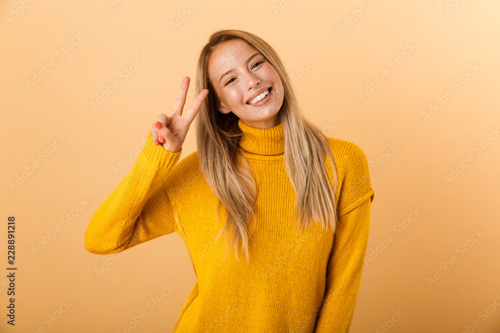 Portrait of a lovely young woman dressed in sweater Portrait of a lovely young woman dressed in sweater