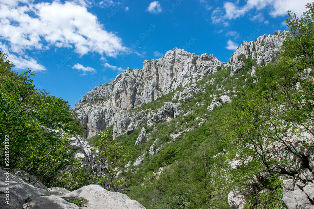 The Mala Paklenica karst river canyon is within national park, Velebit, Croatia. It is famous for hiking in undisturbed nature within deepest canyon in a region.