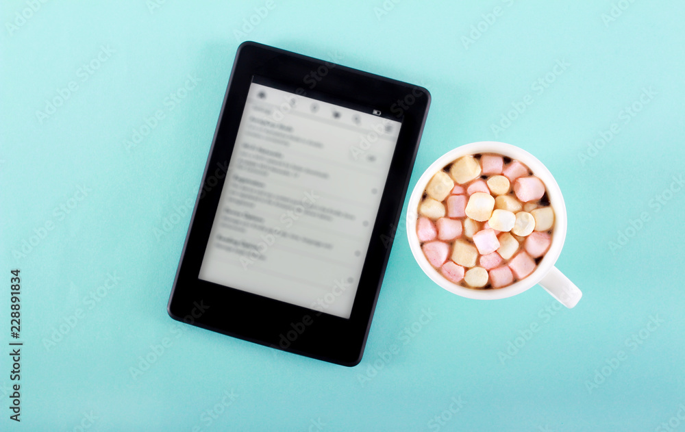 Marshmallow over drink in cup and reader Marshmallow over drink in cup and reader