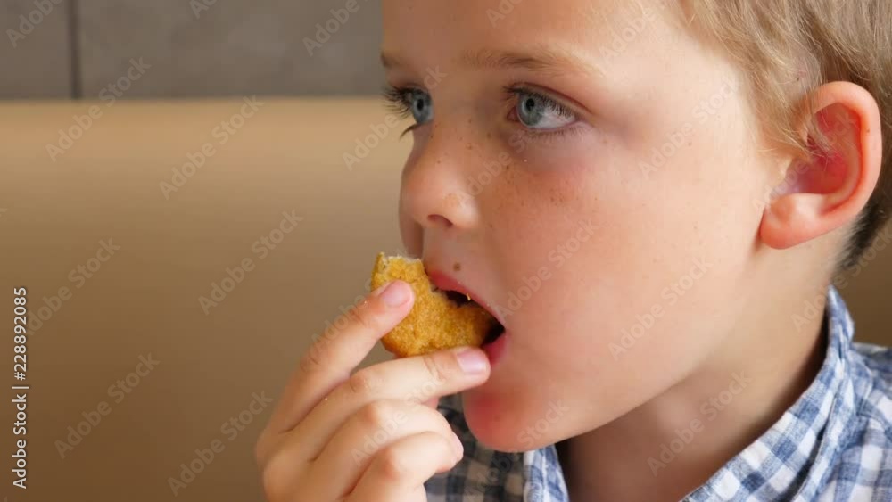 A Little Boy Eats Fast Food Chicken Nuggets And French Fries For Lunch A Little Boy Eats Fast Food Chicken Nuggets And French Fries For Lunch