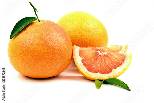 Healthy and benefits of Grapefruits..Grapefruits with slice and green leaf on white background.