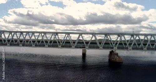 Flying on the side of the steel railroad bridge on a summer day at Kemijärvi Finland photo