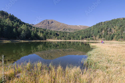 Quiet mountain autumn lake photo