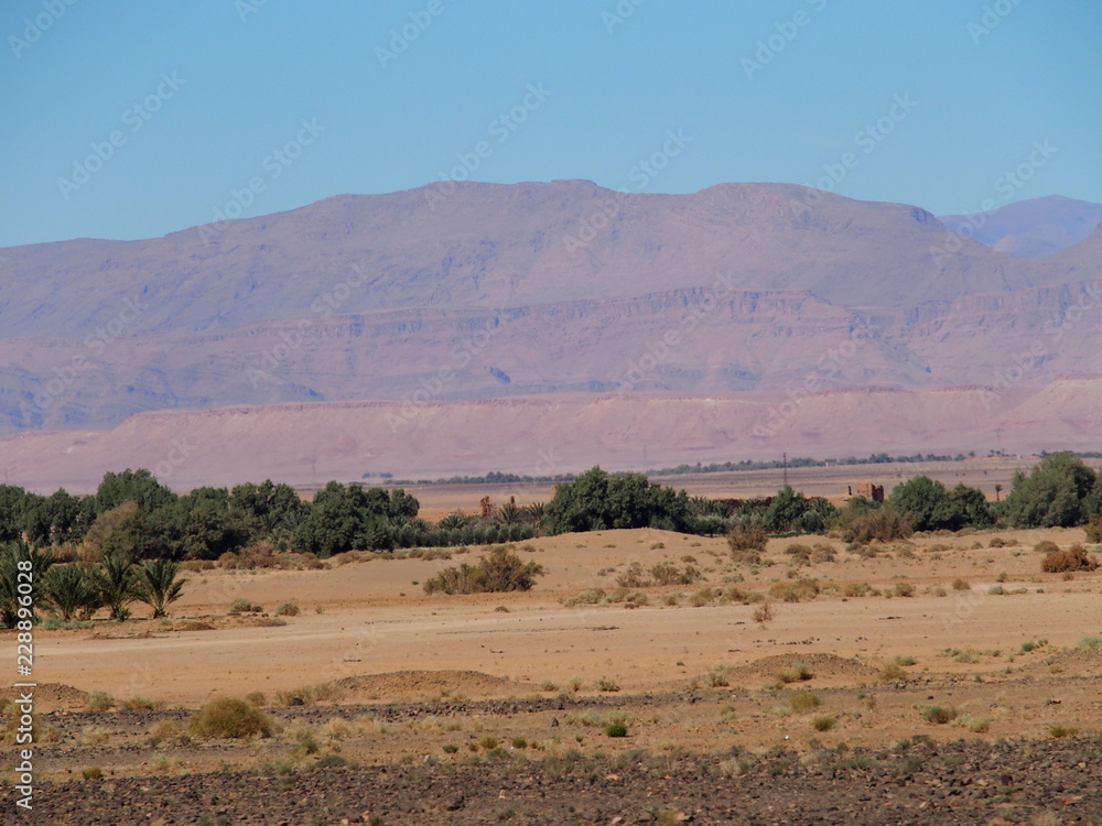 Colored view of sandy desert at high ATLAS MOUNTAINS range landscape in MOROCCO Colored view of sandy desert at high ATLAS MOUNTAINS range landscape in MOROCCO