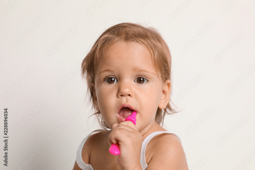Cute little girl with toothbrush on white background Cute little girl with toothbrush on white background