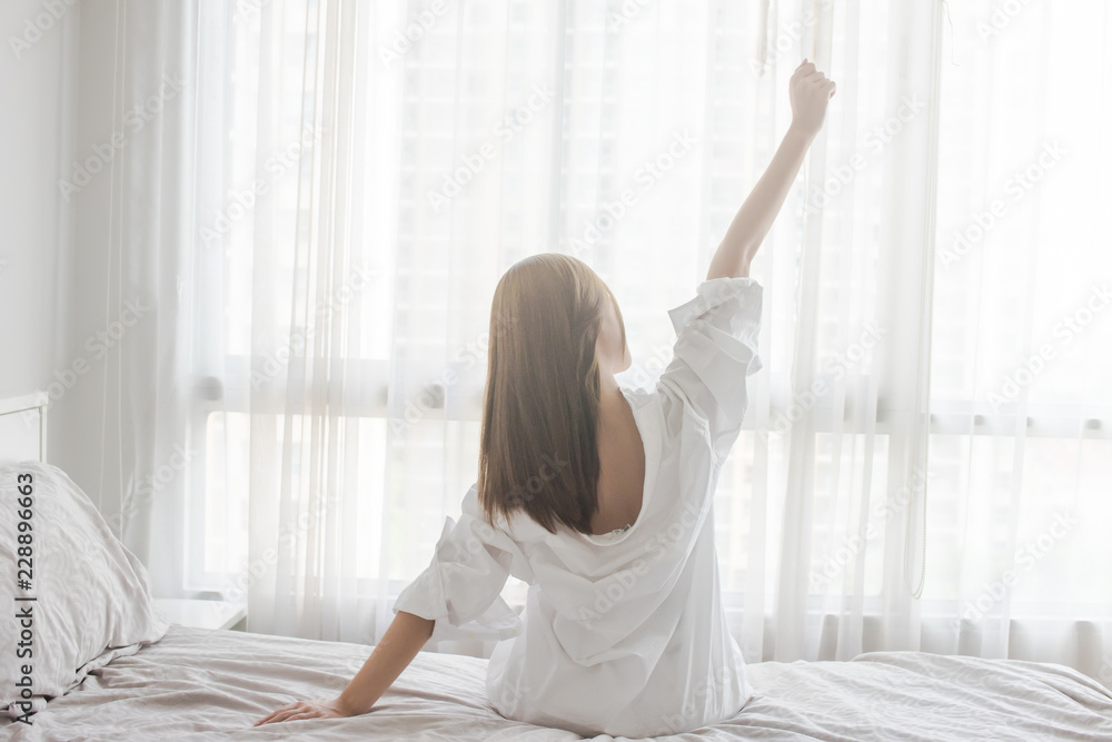custom made wallpaper toronto digitalAsian Woman stretching in bed after wake up, back view