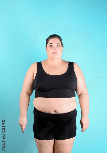 Overweight woman before weight loss on color background