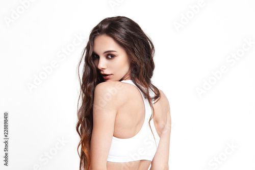 Sexy young woman in underwear on white background