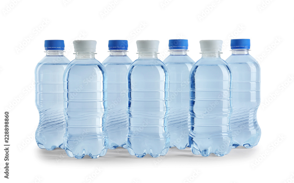 Set of different plastic bottles with water on white background Set of different plastic bottles with water on white background