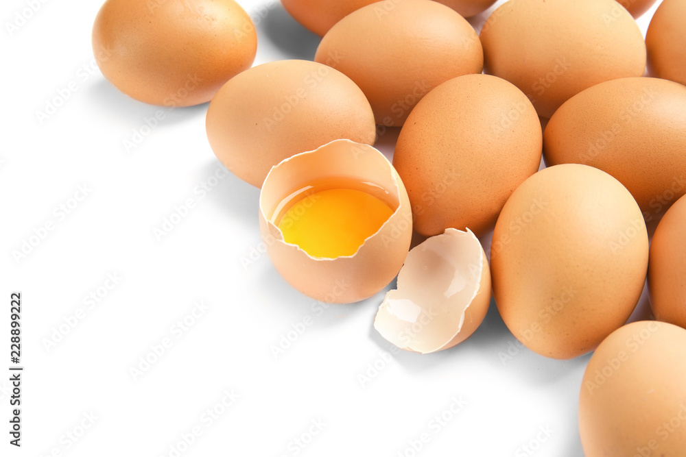 Cracked and whole chicken eggs on white background Cracked and whole chicken eggs on white background