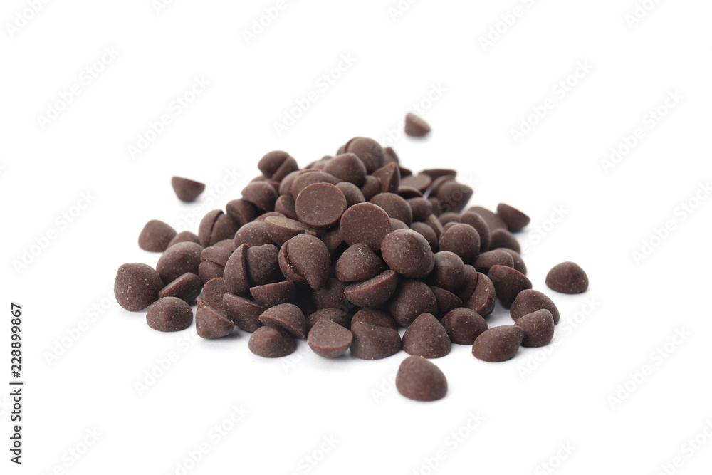 Naklejka premium Pile of delicious dark chocolate chips on white background
