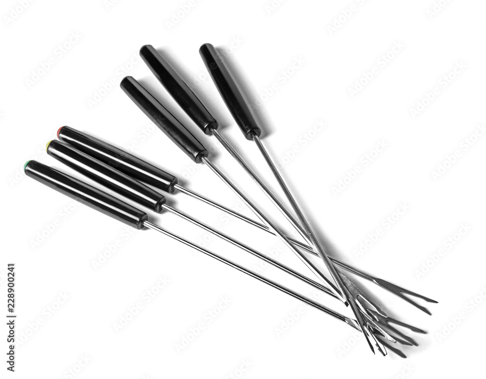 Set of fondue forks on white background. Kitchen equipment Set of fondue forks on white background. Kitchen equipment