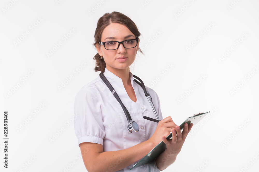 Doctor with stethoscope, holding the document folder on white background Doctor with stethoscope, holding the document folder on white background