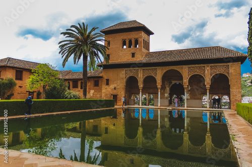 Building of moorish architecture, with a pond / lake,