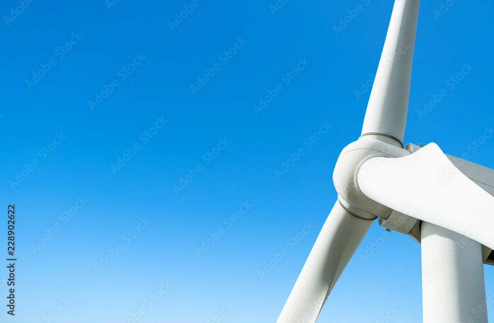 big wind turbine on blue sky background big wind turbine on blue sky background