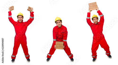 Construction worker with clay bricks on white