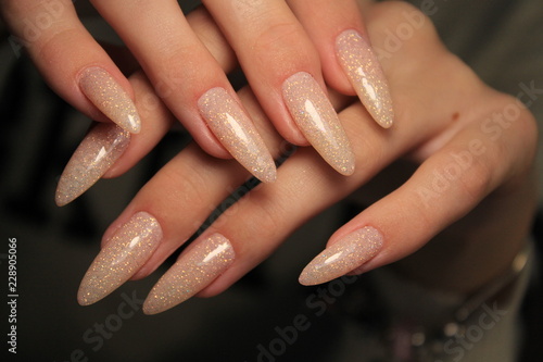 beautiful nail art manicure on the background of a fashionable texture