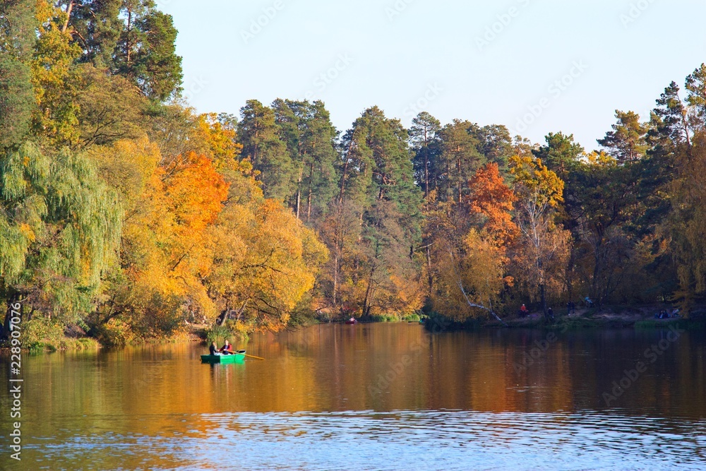 autumn landscape with boat in the lake and trees autumn landscape with boat in the lake and trees