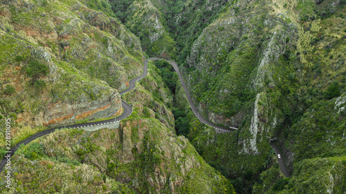 drone top view bended road on mountain of Paul do Mar, Madeira island, Portugal