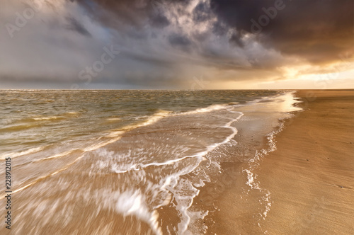 rainy sky over stormy North sea coast