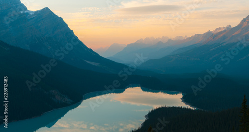 The orange glow of sunset over Peyto Lake in Banff National Park in autumn