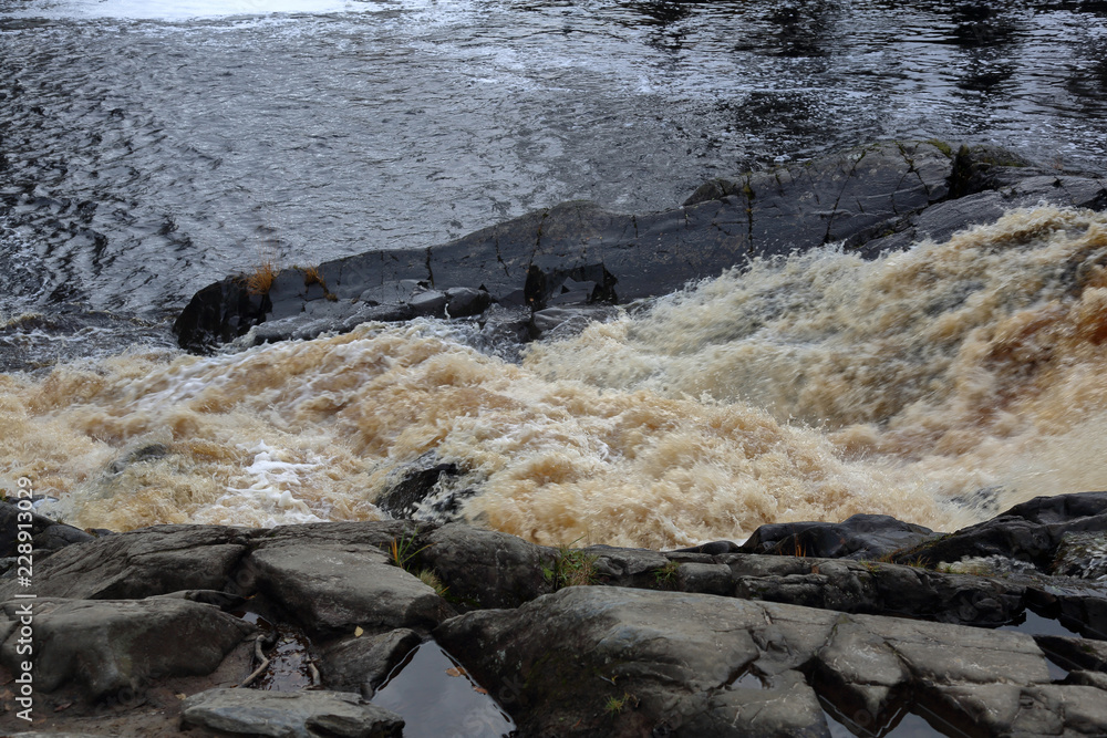 Fototapeta premium Scenic Karelian waterfall Ahvenkoski in autumn. Russia 