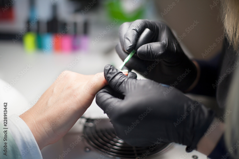 Manicure. Close-up Of Female Hands Filing Nails With Nail File In Beauty Salon. Nail Care Tool. High Resolution