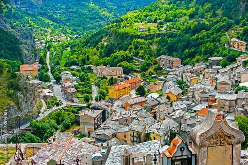 Town of Tende in French Alps, built in terraces on a hillside, is dominated by the Clock Tower and the ruins of the castle of the Lascaris. photo