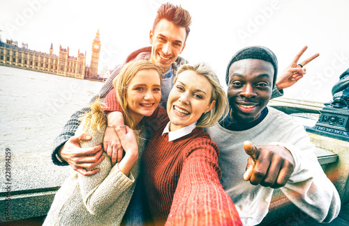 Canvas Print Happy multiracial friends group taking selfie in London at european trip - Young