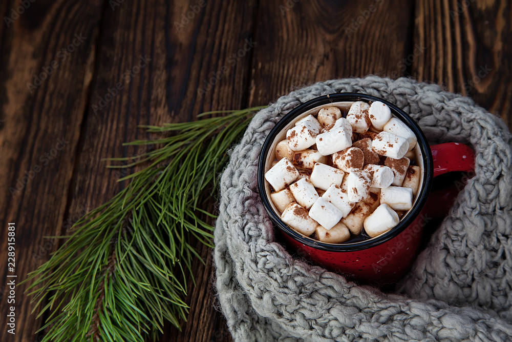 red Cup with marshmallow on wooden new year background red Cup with marshmallow on wooden new year background