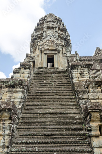 Tower of Angkor Wat with the steep stairways photo