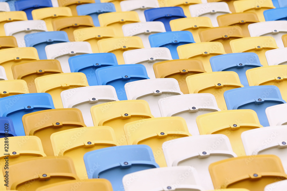 Naklejka premium A field of empty plastic seats on the stadium