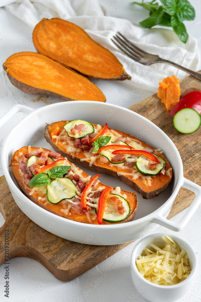 Baked sweet potato with bacon, sour cream, zucchini, red pepper and cheddar cheese. Baked sweet potato with bacon, sour cream, zucchini, red pepper and cheddar cheese.