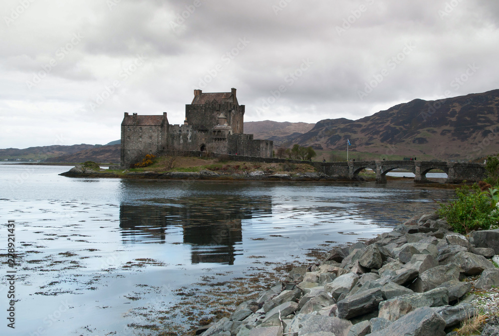 Eilean Donan castle mirroring in water of Loch Duich