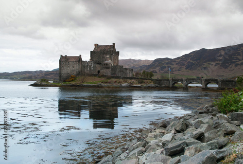 Eilean Donan castle mirroring in water of Loch Duich