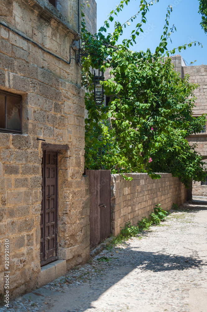 Residential alley and dwellings in old town.  Rhodes, Old Town, Island of Rhodes, Greece, Europe.