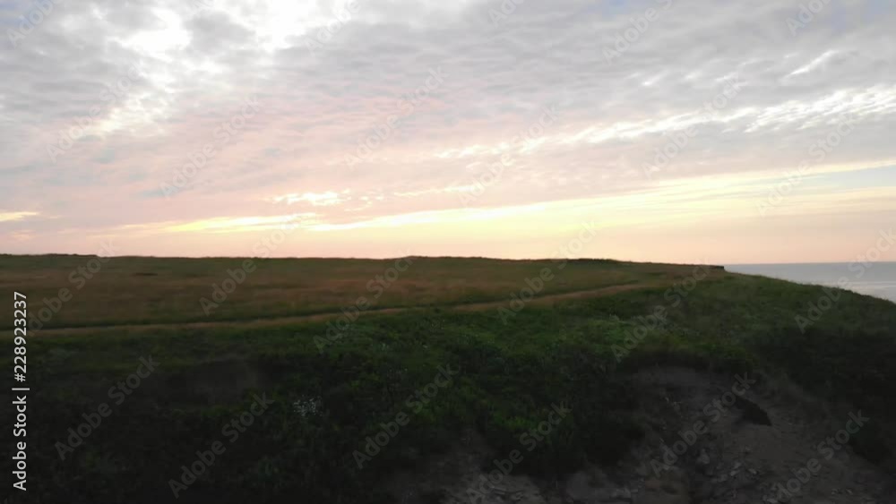 Aerial Dolly Of An Ocean Cape And Beautiful Golden Sunset In The Evening Aerial Dolly Of An Ocean Cape And Beautiful Golden Sunset In The Evening