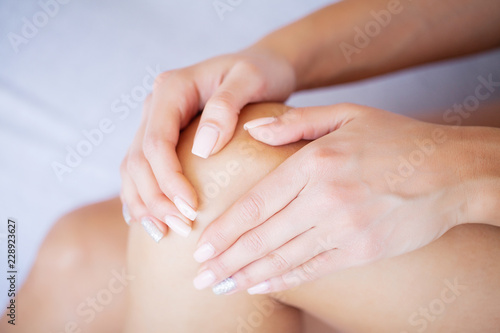 Leg Pain or Calf Muscle In a Girl on Bed, Healthy Concept