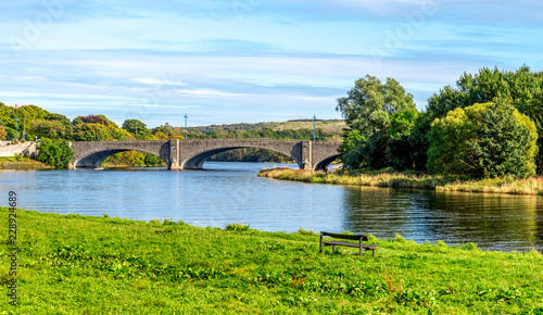 A scenic view of am ached bridge and river Dee in a beautiful sunny day, Aberdeen, Scotland
