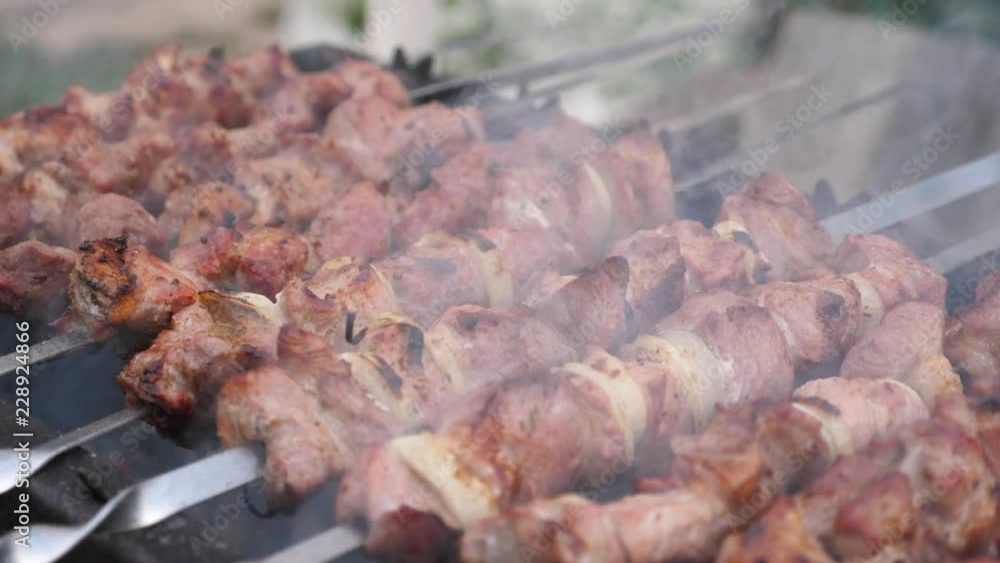 Grilling pork kebab on skewers at bbq Grilling pork kebab on skewers at bbq