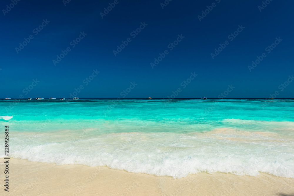 Wonderful tropical sea and turquoise water surface, Beautiful blue sea with blue sky at Tachai island, Thailand